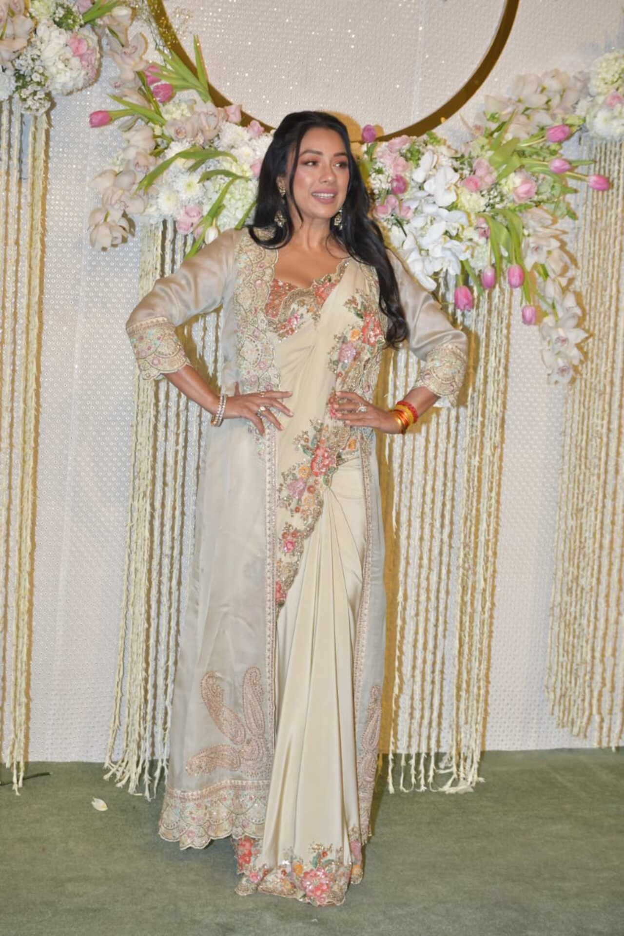 TV's favourite star Rupali Ganguly graced the reception in a gorgeous off-white saree with a cape of matching colour