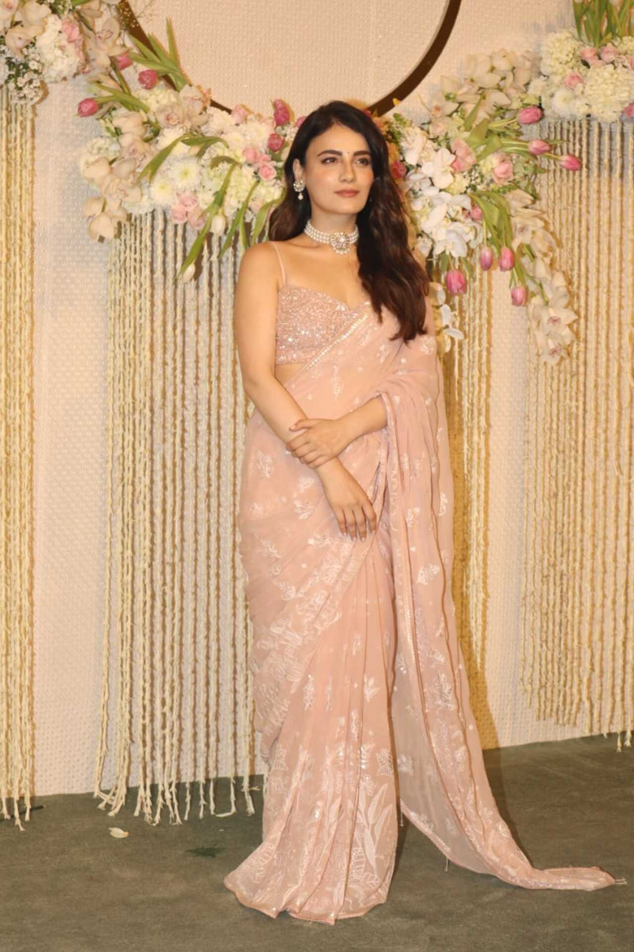 Radhika Madan also opted for a pastel saree like her 'Sajini Shinde Ka Viral Video' co-star Nimrat Kaur. She completed the look with a diamond choker necklace