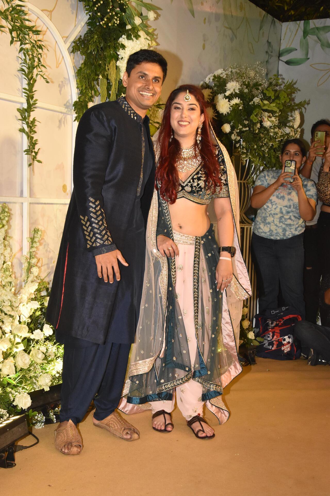 Ira looked gorgeous in a deep-cut choli with pink and green coloured dhoti pants. She elevated her wedding look with a stunning silver dupatta placed over her head. Nupur wore a blue bandhgala suit