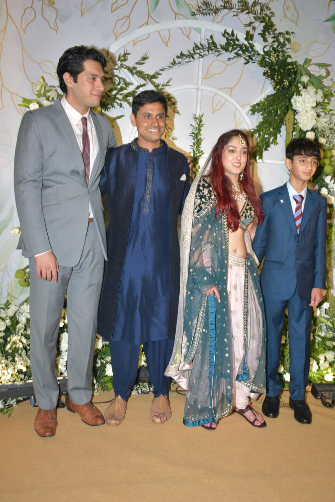 The Khan siblings pose together- Ira and Nupur pose with the bride's brothers Junaid and Azad. The two brothers looked dashing in a suit for Ira's big day