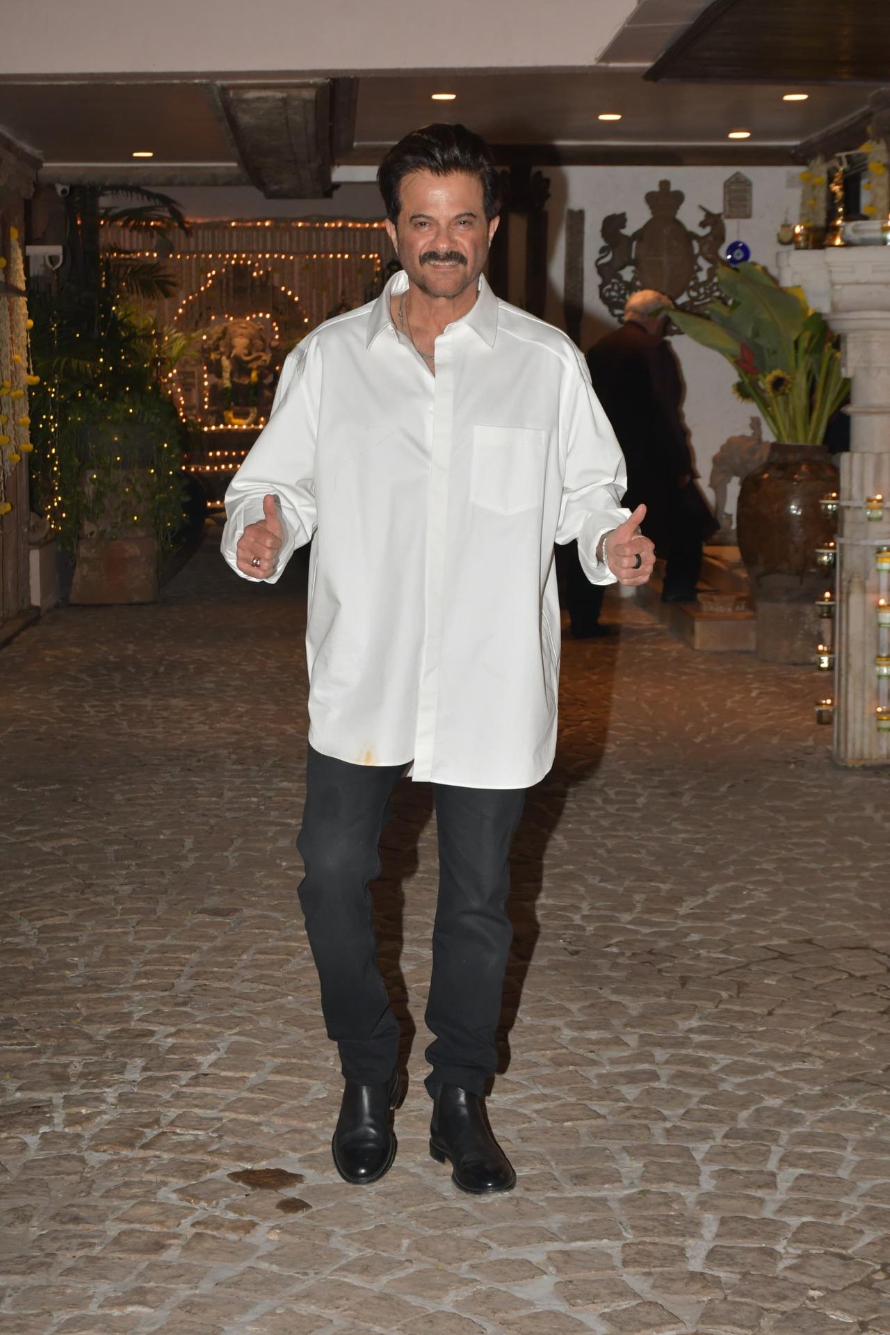 Host Anil Kapoor looked stylish in an oversized white shirt and black pants for the party he hosted at his Juhu home