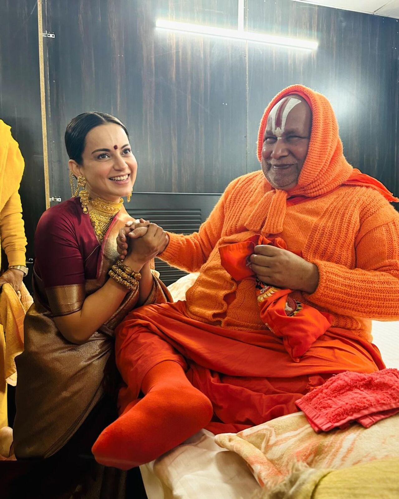 Kangana also shared pictures of her having a light moment with saint Rambhadracharya as she takes his blessings