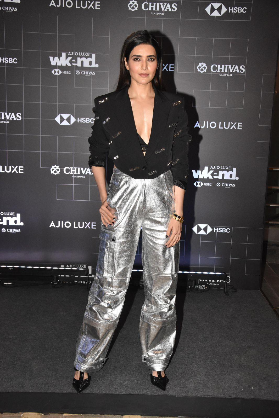 Karishma Tanna is always sure to serve looks and she did not disappoint last night, Karishma Tanna paired metallic pants with a black top which featured a dramatic sleeve