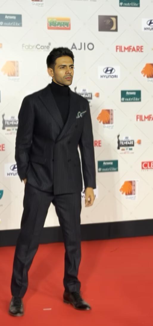 Kartik Aaryan rocked a suit paired with a high-neck black turtleneck. The actor looked dashing as ever as he posed for the paparazzi