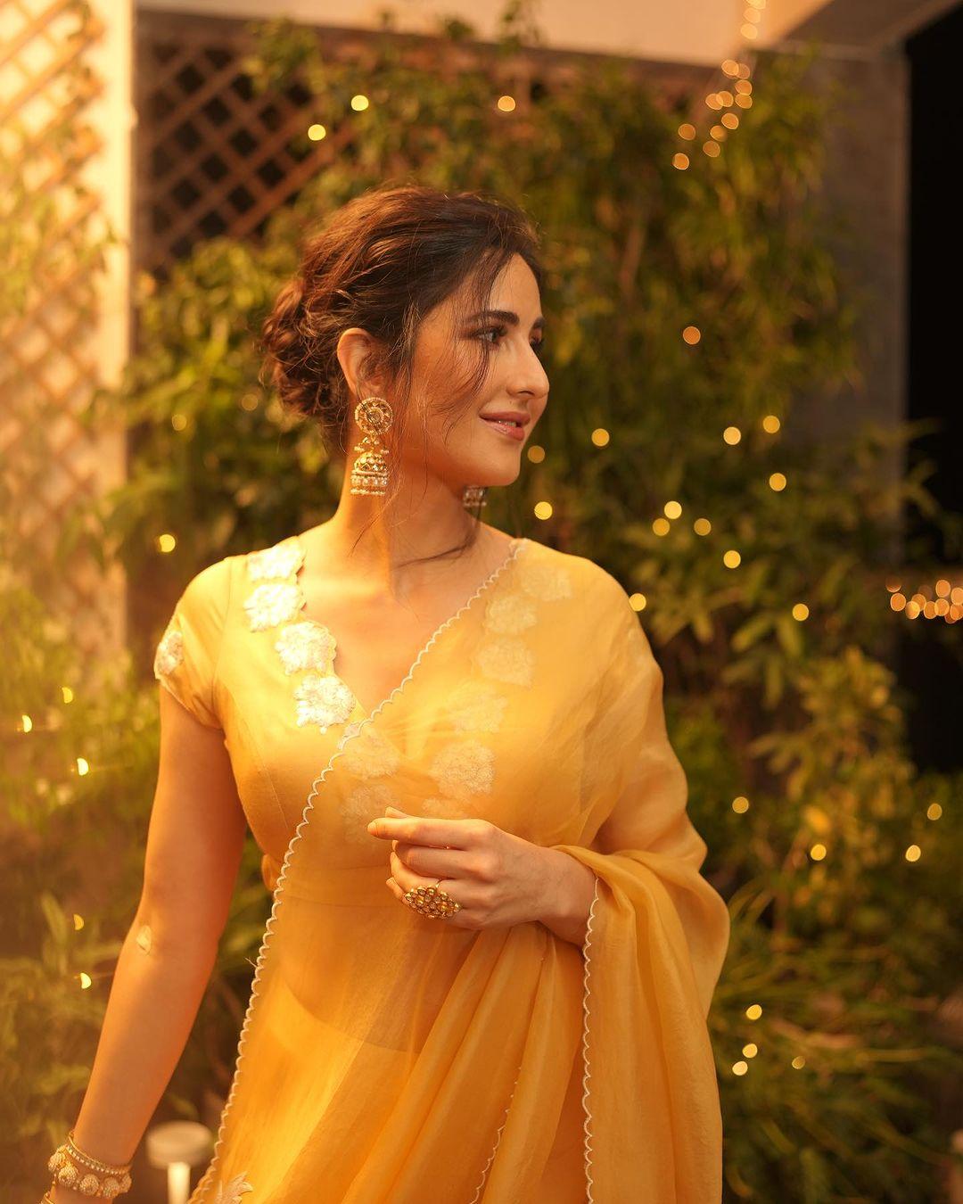 Her look was on point, with a stylish cutout blouse, a deep neckline, and chic golden jhumkas.