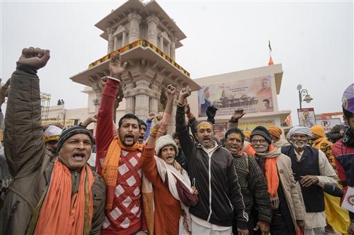 Devotees chant religious slogans near the entry point for Ram Mandir on Saturday