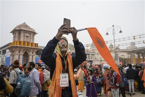 A devotee clicks a picture near the entry point for Ram Mandir