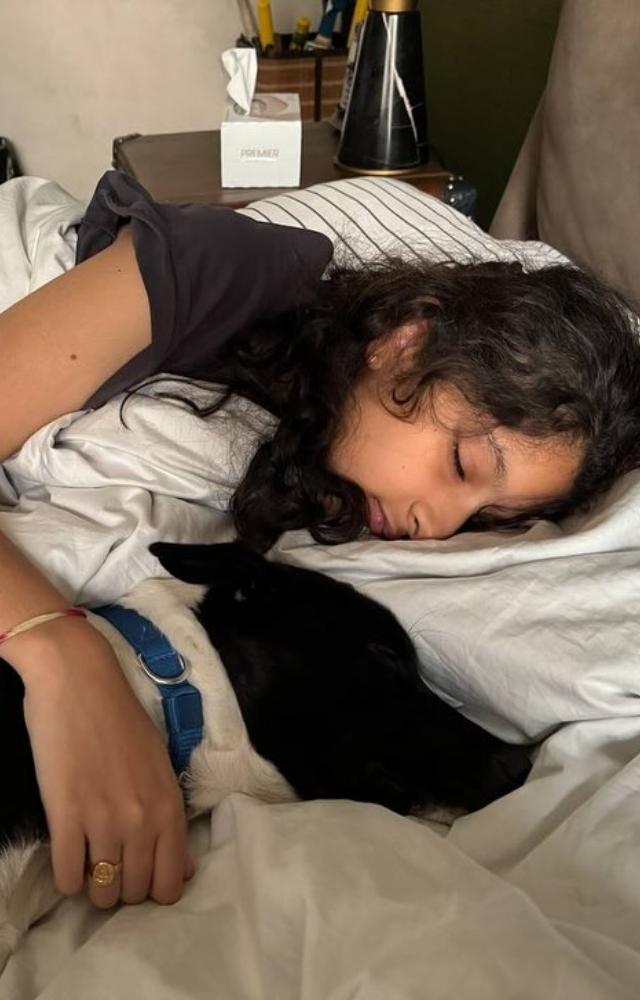 Namrata keeps her feed raw and unfiltered. Here we see a picture of her daughter taking a nap with their dog