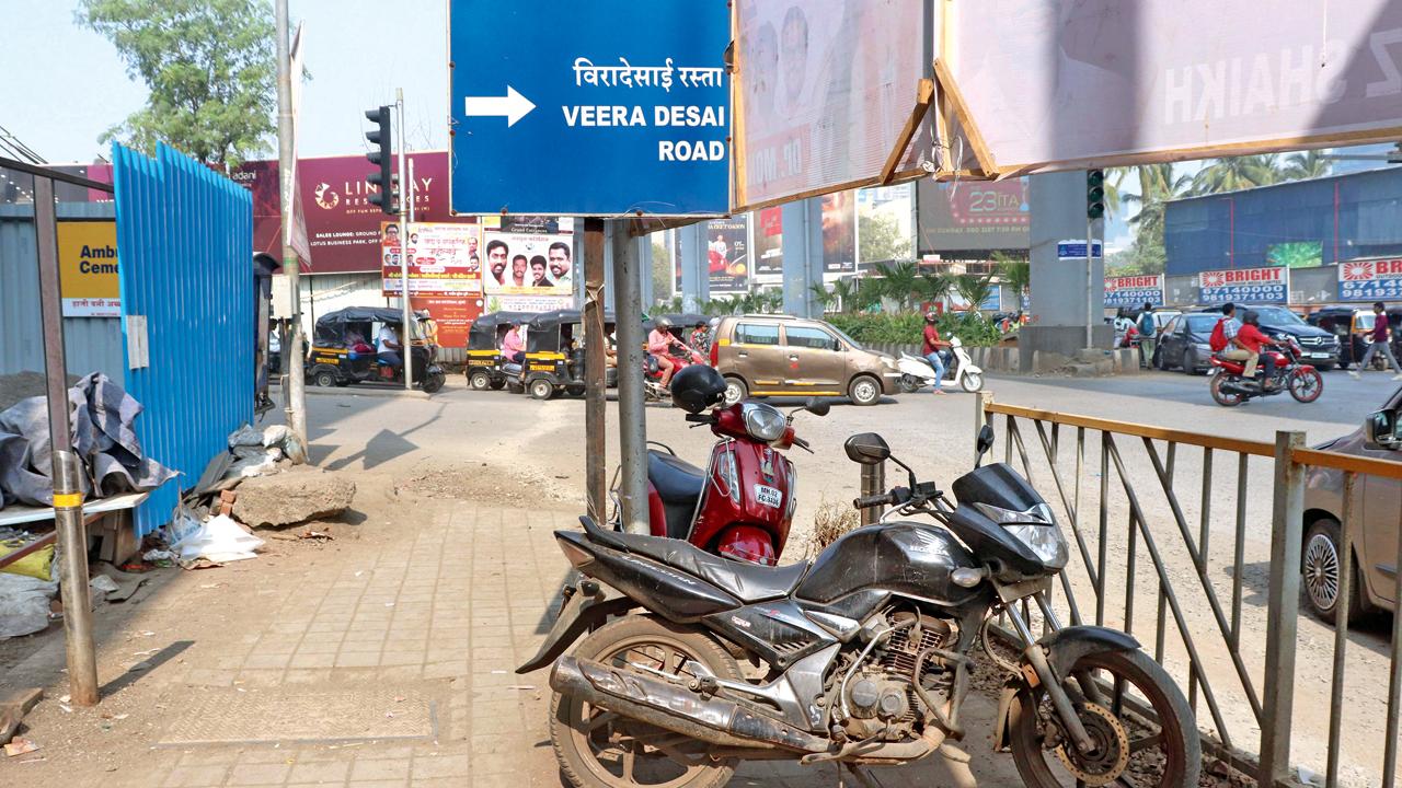 Two-wheelers on a footpath at the RTO signal in Andheri West