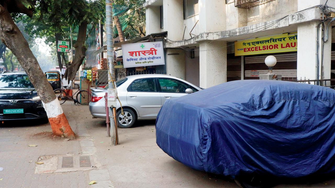 Vehicles gobble up space on a Nehru Road pavement in Vile Parle East