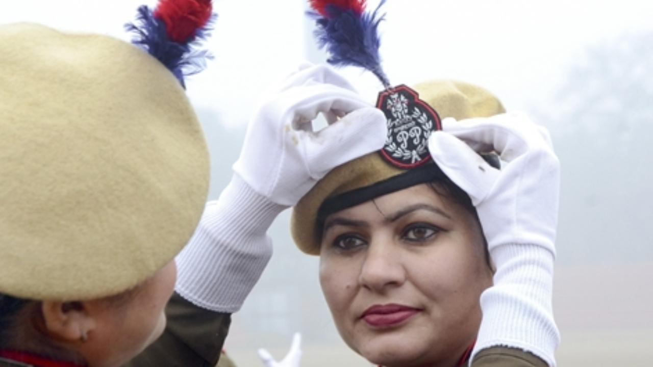 Woman police official from Punjab Police dressing up for the rehearsal for the Republic Day Parade