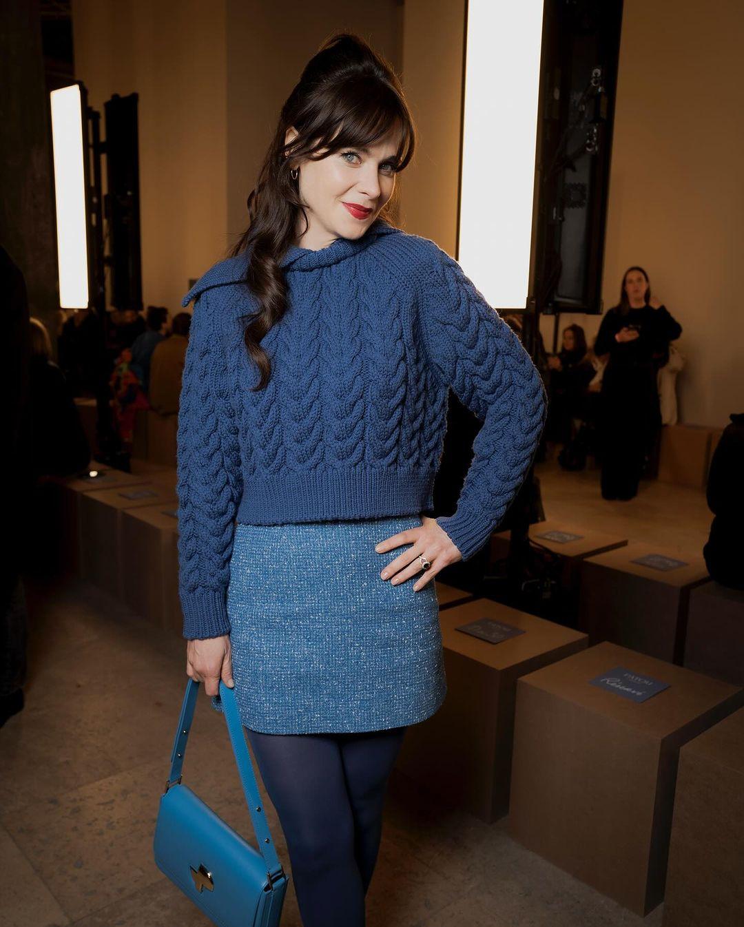 The New Girl star made a fashionable statement at the Patou show, donning different shades of blue from top to bottom. She paired a chunky cobalt blue crewneck sweater with a lighter blue tweed miniskirt. Completing the look, she chose blue patent leather ankle-strap heels and carried a chic cerulean shoulder bag with gold hardware.