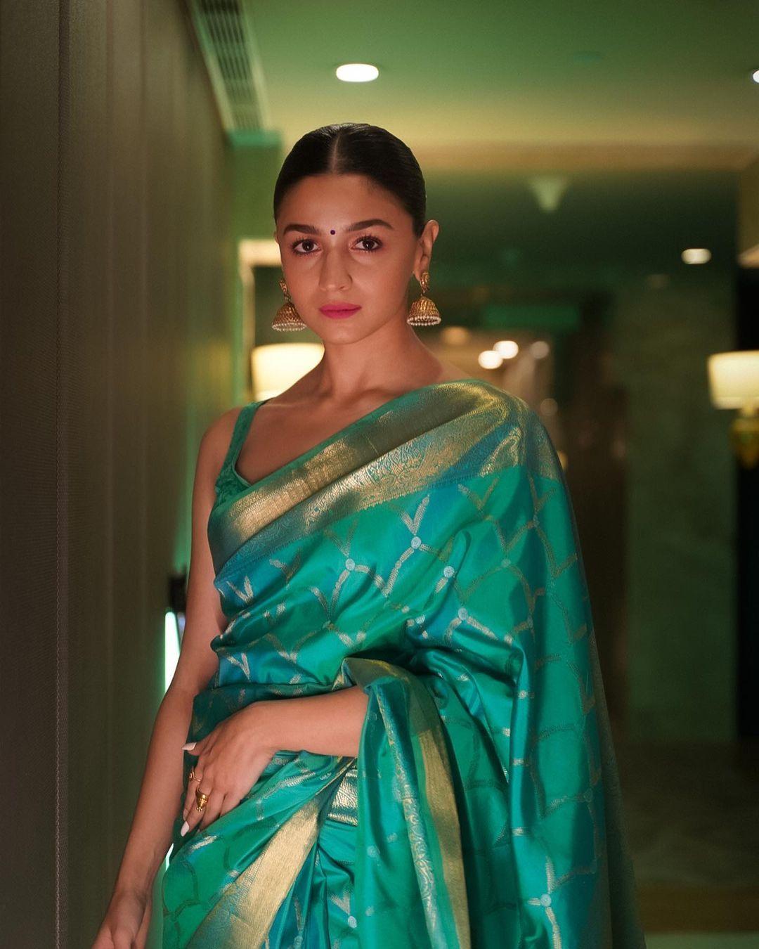 This saree serves as an excellent choice for Republic Day attire. Alia adorned a stunning green Kanjeevaram silk saree with a delightful gold border