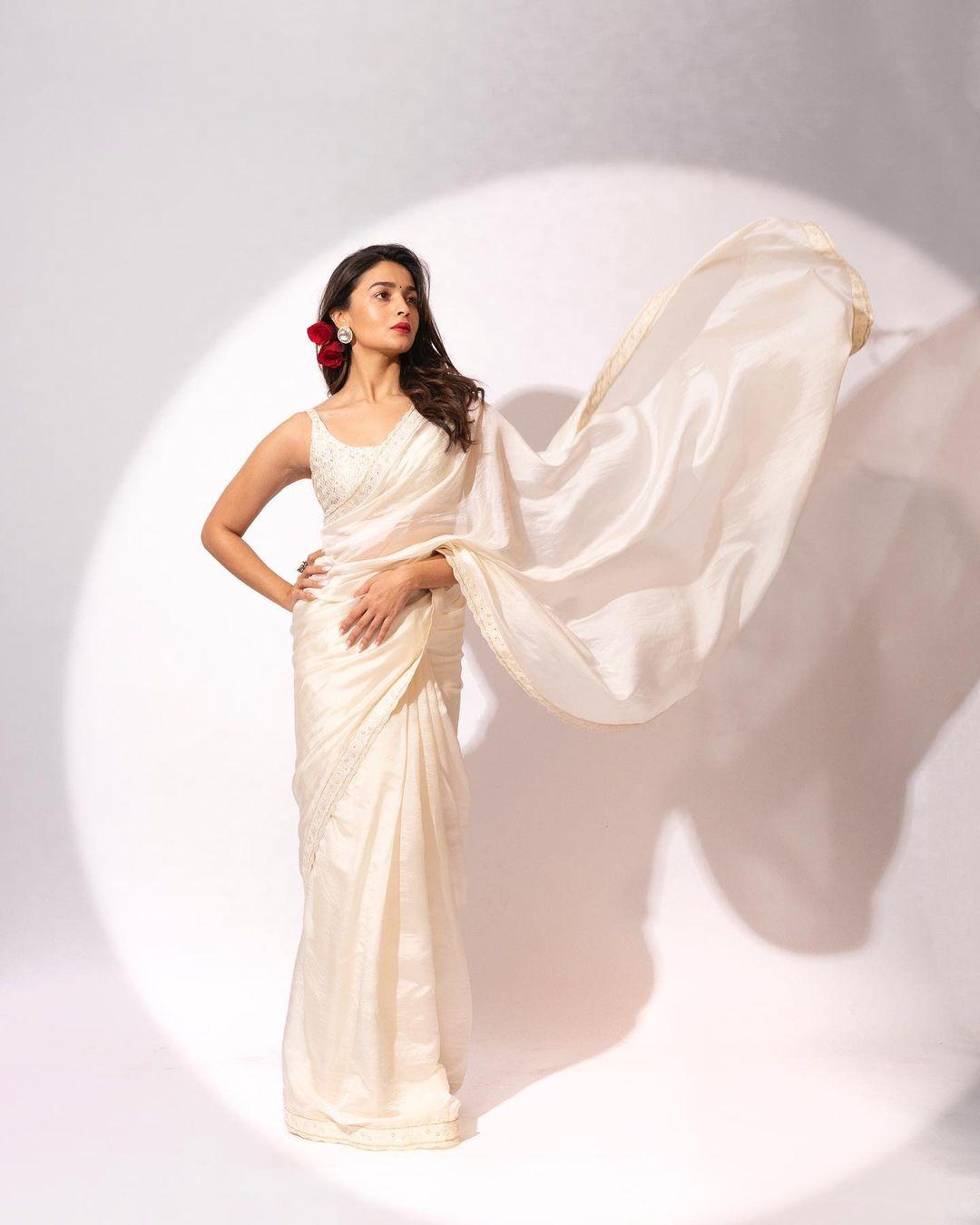 This saree serves as the ideal inspiration for Republic Day attire. Alia donned an ivory saree adorned with detailed coin embroidery and resham patra work. 