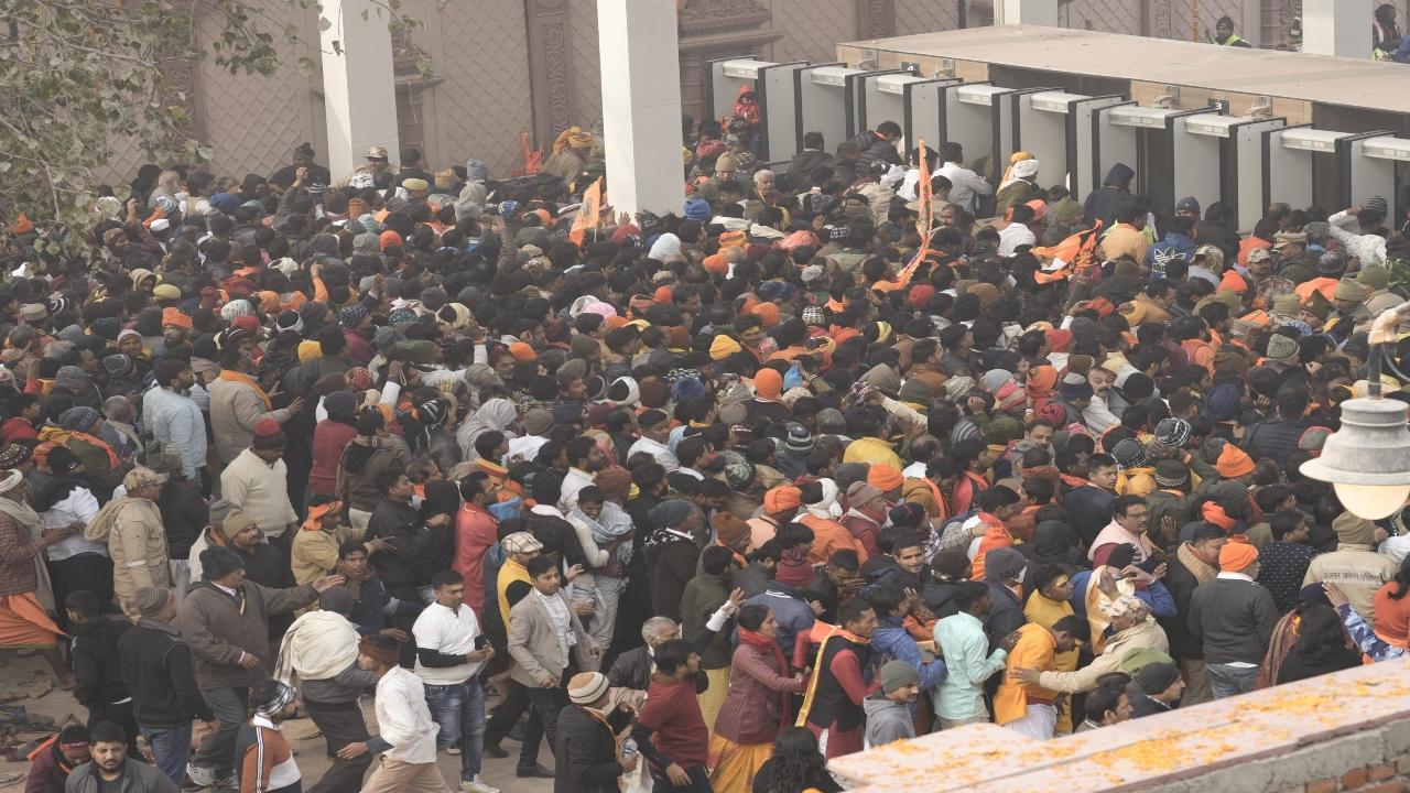 A massive crowd that swelled by the hour and became unmanageable in the afternoon thronged the main gateway to the Ram temple in Ayodhya