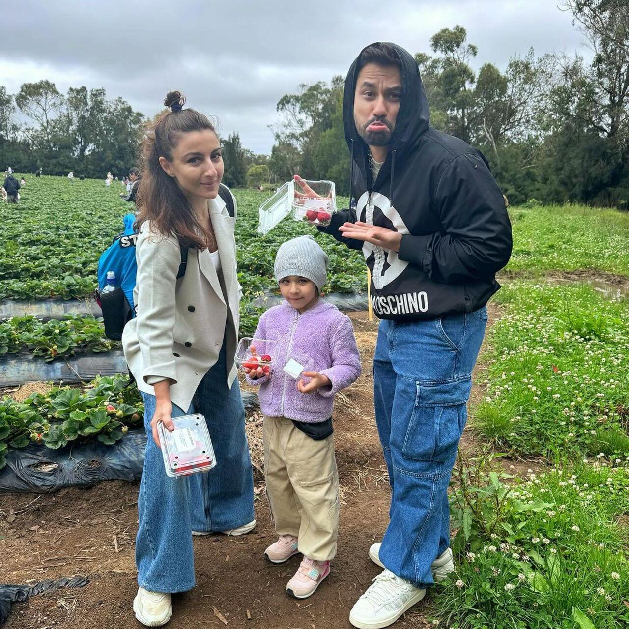 The trio also went strawberry picking at a berry farm in Australia. They were seen dressed in warm clothes indicating a cool temperature in the country
