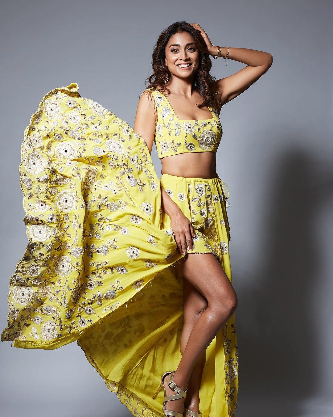 Shriya Saran gets playful in this yellow Payal Singhal lehenga. Fuss-free and simple, this outfit adds a dose of childish innocence to Shriya's look