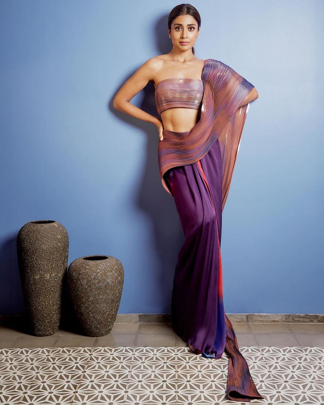 Shriya Saran flaunts a purple Amit Aggarwal saree in the designer's signature fluid and futuristic style. Perfect fusion fashion