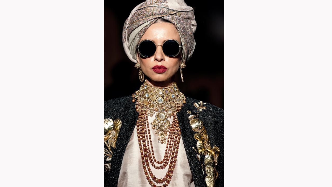This deconstructed Jadau titled, the Maharani Necklace, inspires a sort of bohemian-royal personality wearing a languid assortment of uncut diamonds, sapphires, tourmalines and pearls
