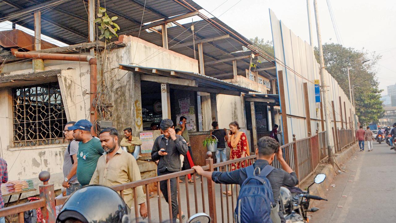 The 110-year-old Sion rail bridge being barricaded ahead of its demolition, on Tuesday. Pic/Satej Shinde