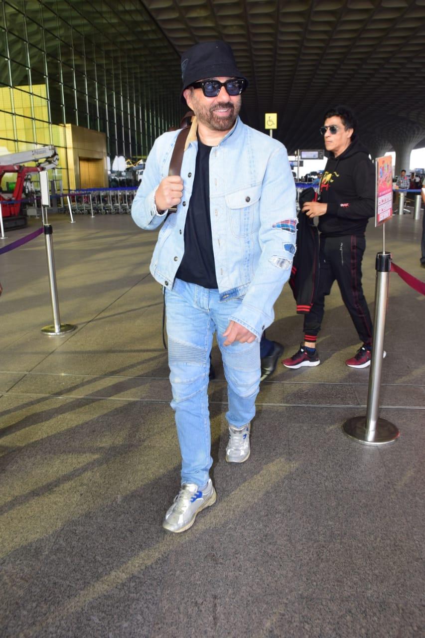 The 'Gadar 2' actor was seen wearing a denim dominated look with his signature black bucket hat