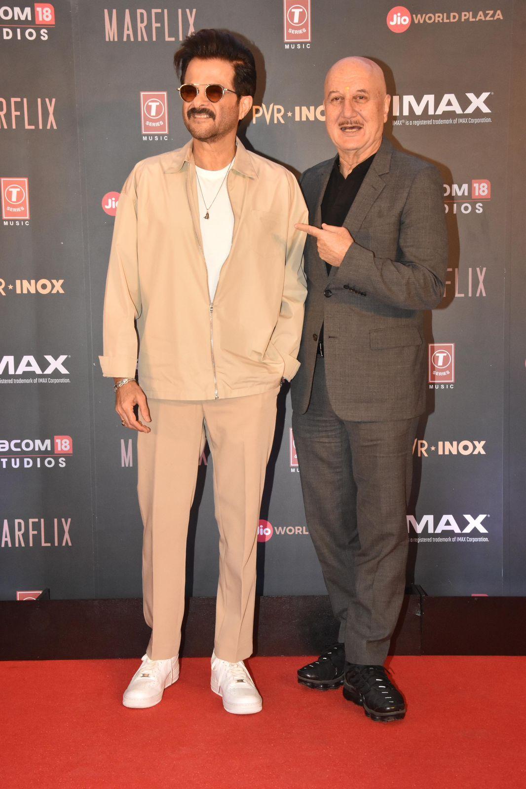 Anupam Kher struck a pose with Anil Kapoor at the movie premiere