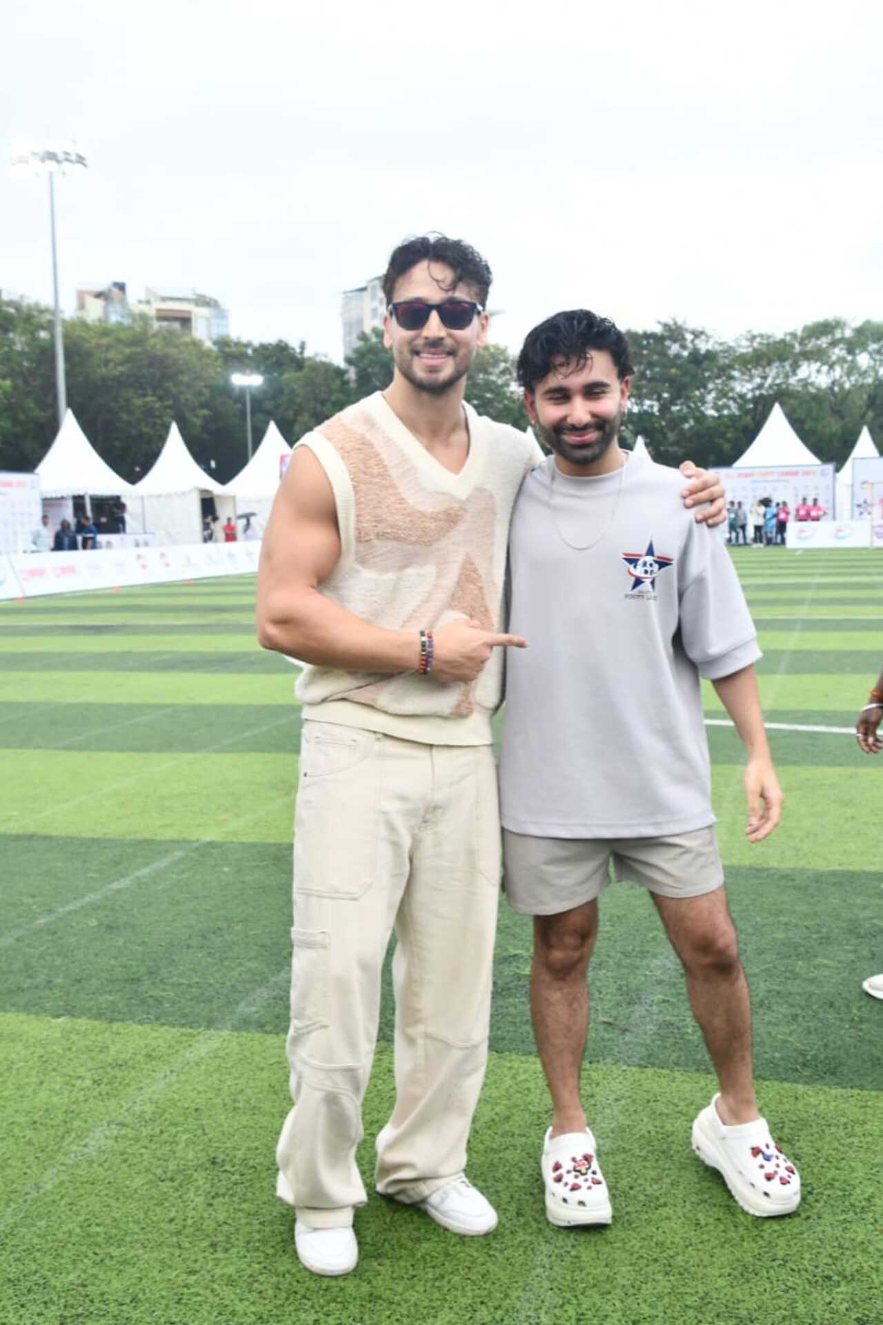 Tiger Shroff poses with Orry on a football field