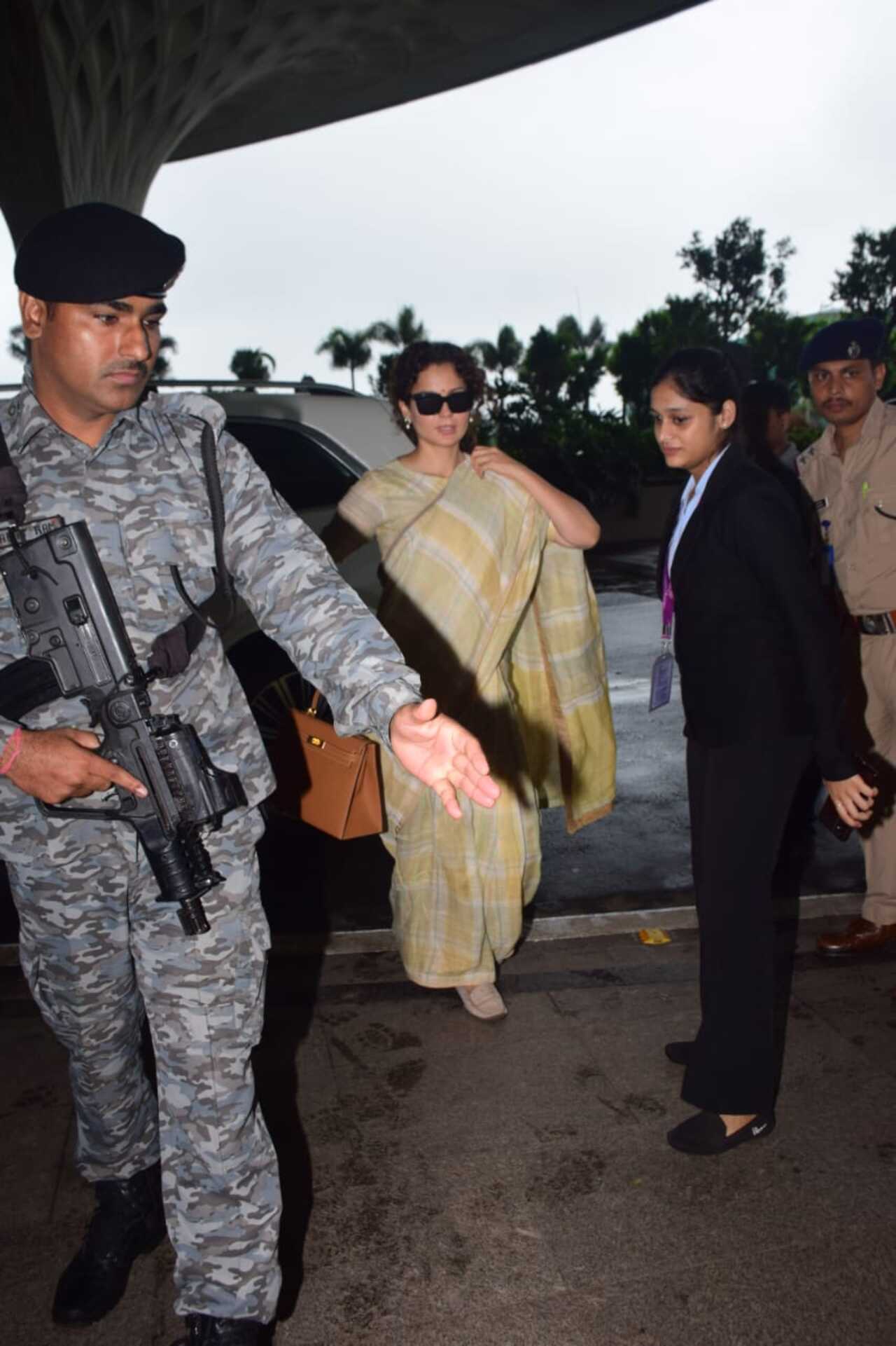 BJP MP and actor Kangana Ranaut was surrounded by her security at the airport