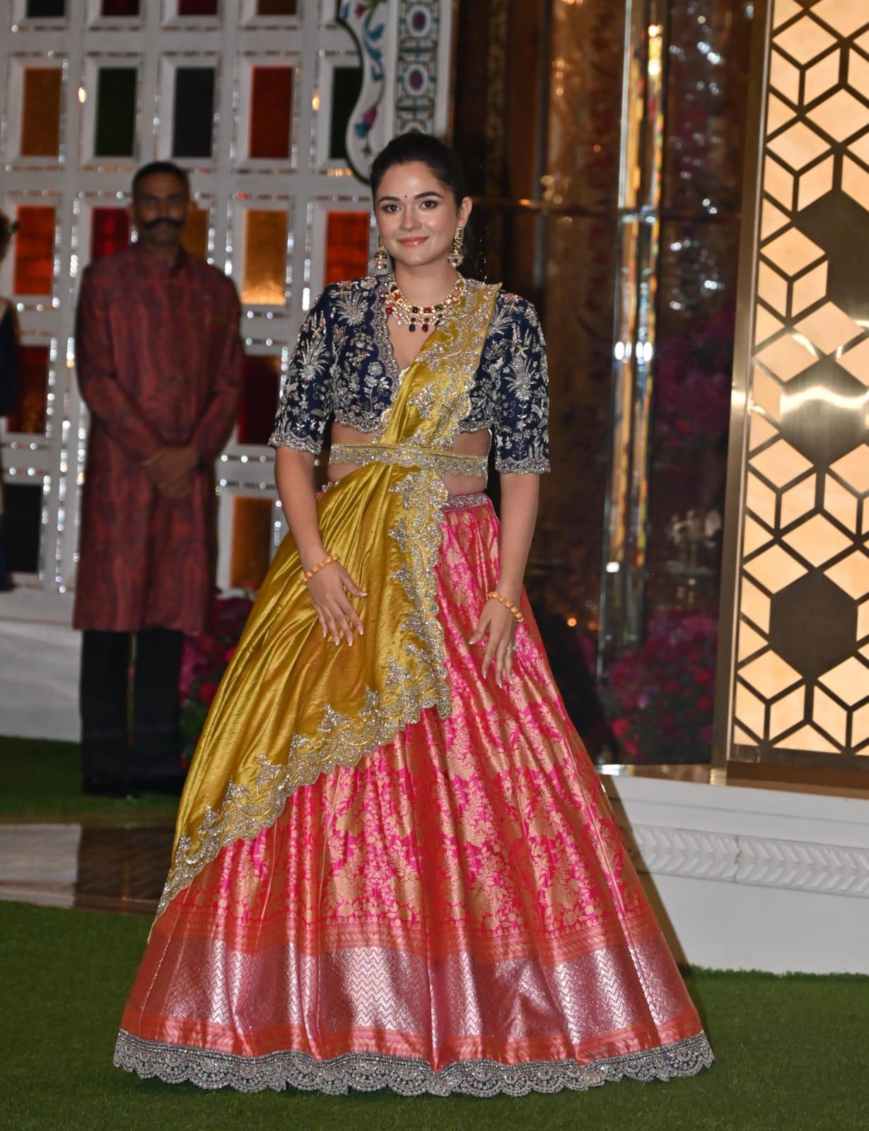Anjali Merchant wore a beautiful red lehenga and paired it with blue blouse and yellow dupatta for her sister's haldi ceremony