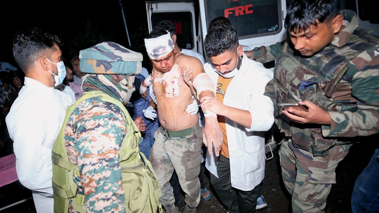 An army soldier injured is being taken for treatment. Pics/PTI