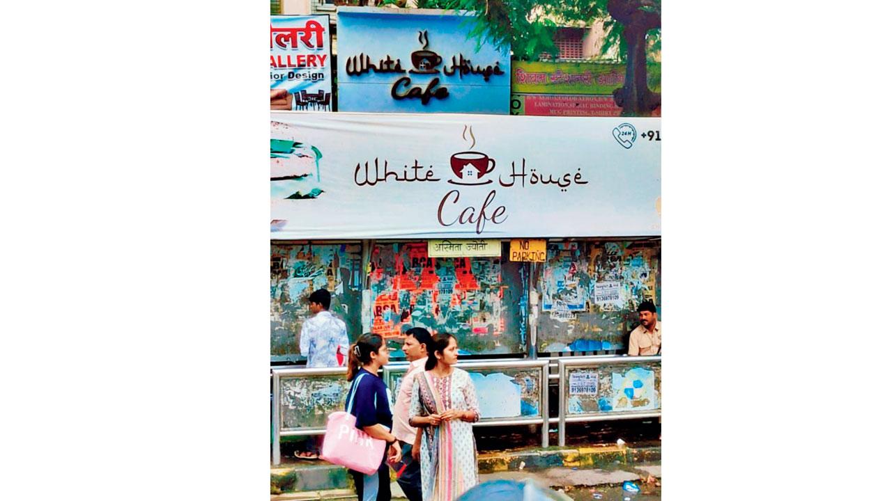 Baba Khan’s cafe is located behind a bus stop on which the establishment is illegally advertised