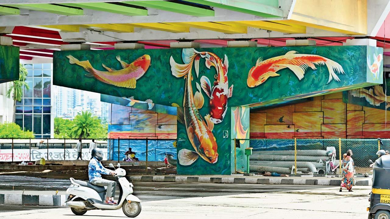Giant, multi-coloured koi fish hug the pillars at the Belapur flyover in Navi Mumbai