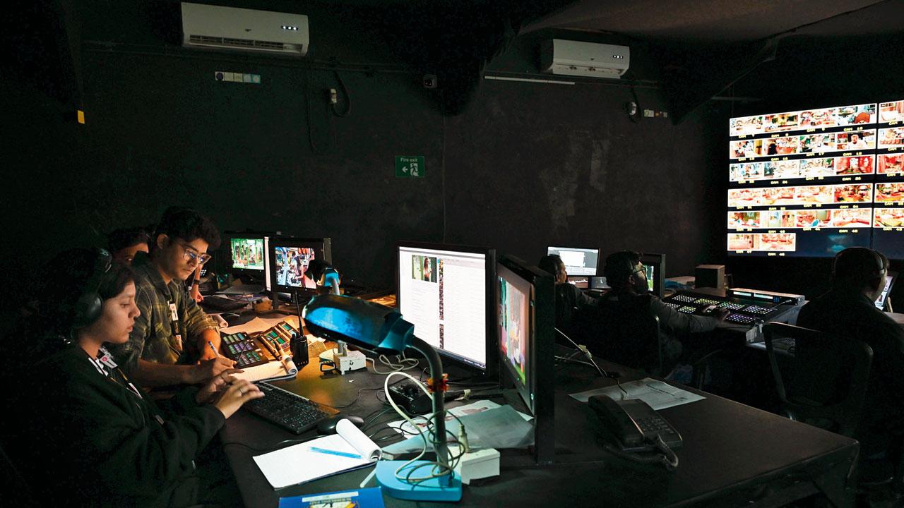 Writers and editors in the production control room 