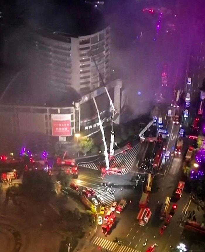 Dramatic images and videos showed a huge column of black smoke billowing from the building. Several people were also seen gathered on a balcony