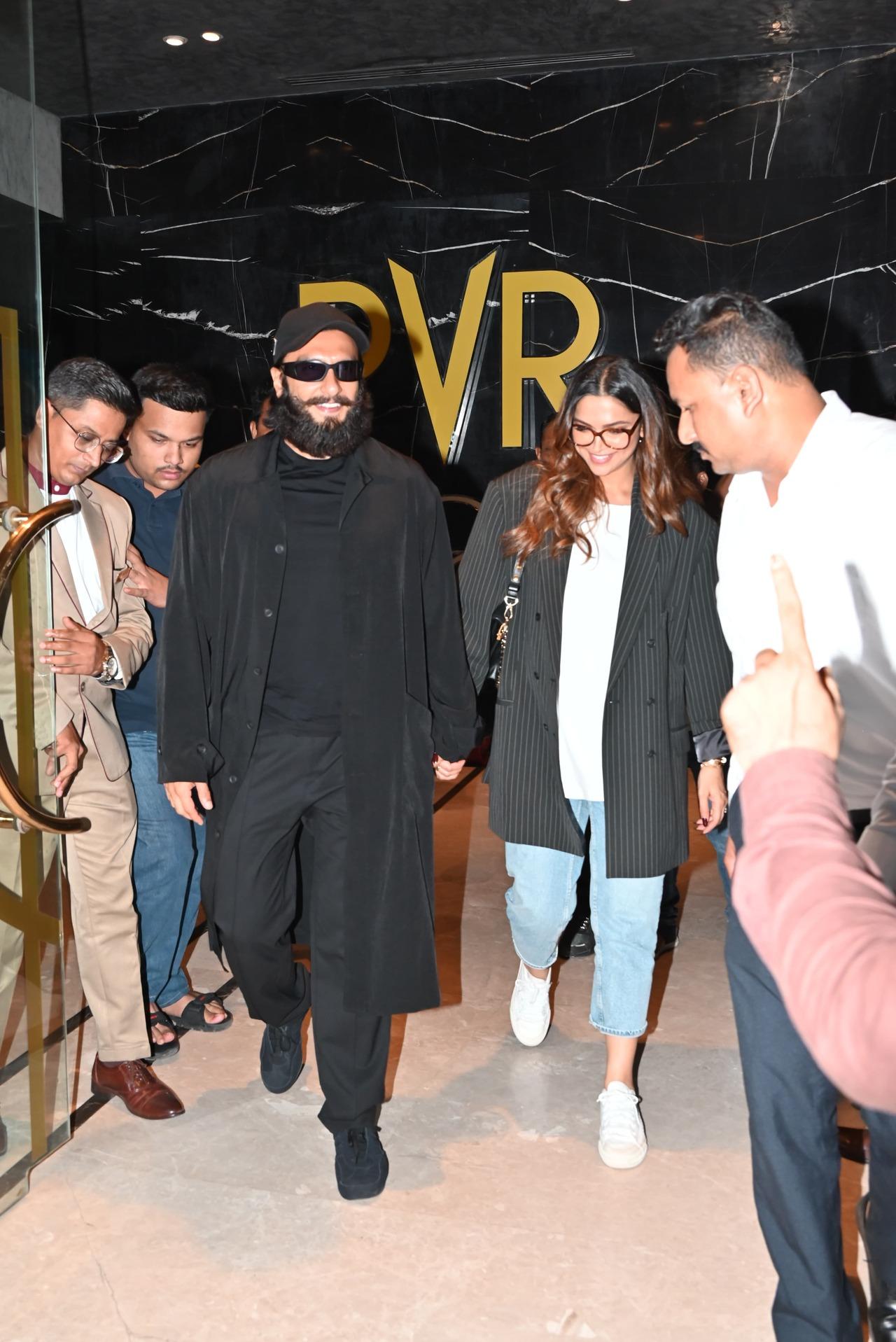 The couple who is set to welcome their first child in September this year were all smiles as they were photographed by the paparazzi at a movie theatre. 