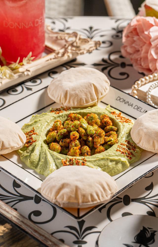 Indulge in Miso hummus with fresh sourdough crostini, togarashi edamame with chili crisps, wontons or Lamb birria tacos