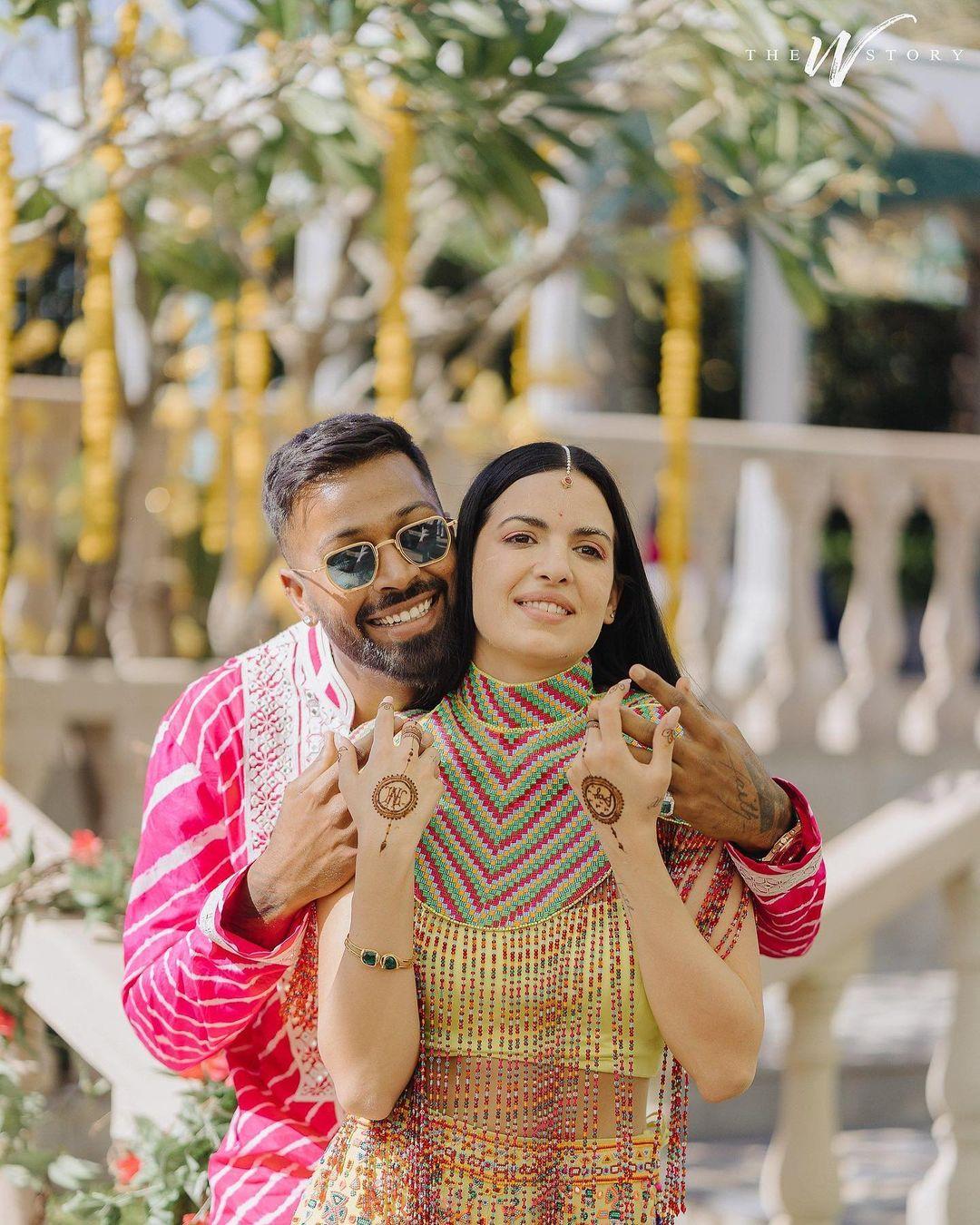 For their other wedding festivities, Natasa wore a yellow indo-western dress, while Hardik complemented her in a striking pink kurta