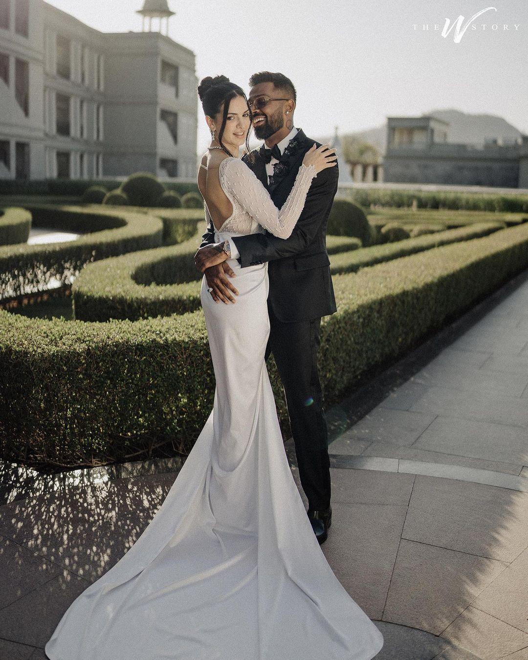 For their Christian wedding, Hardik wore a black tuxedo, while Natasa wore a beautiful white embroidered gown