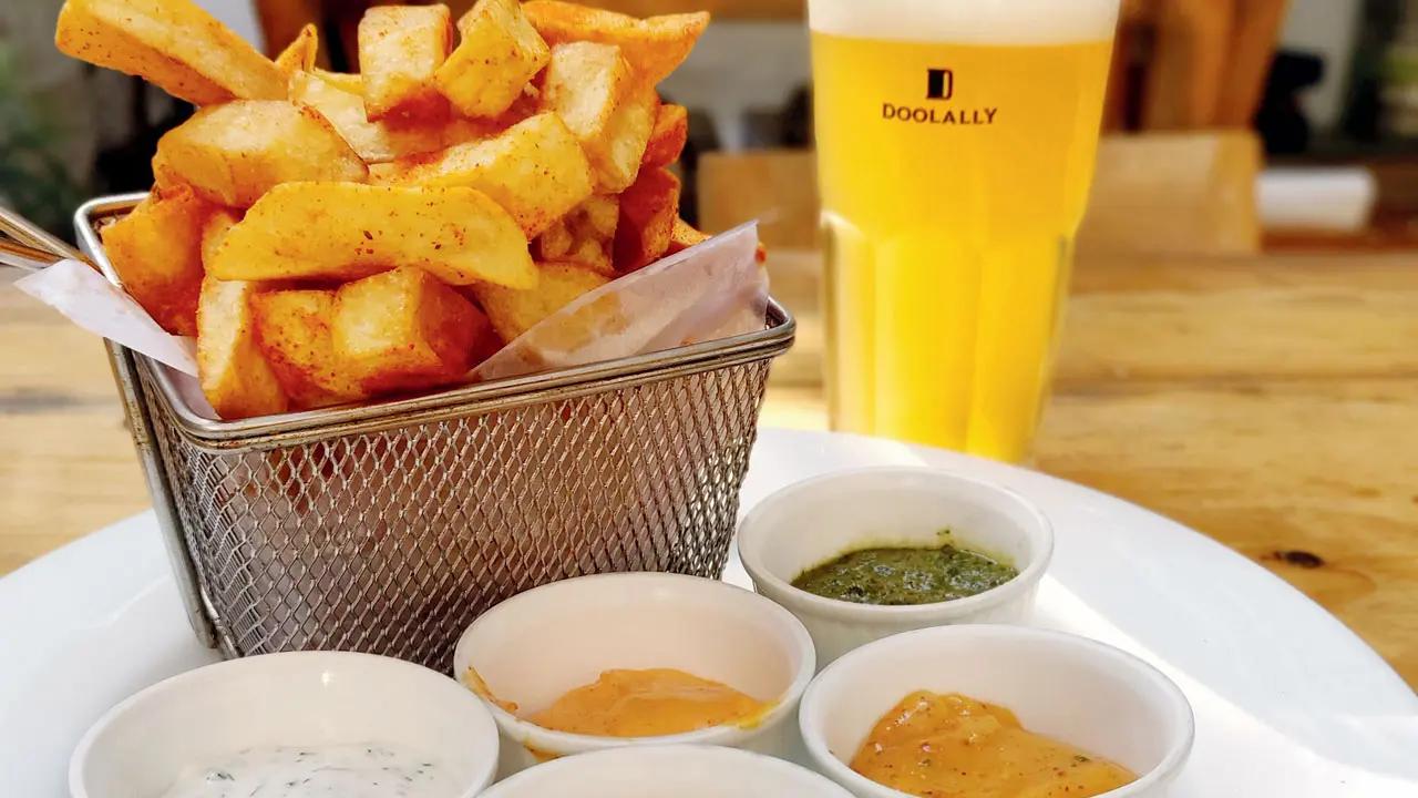 Fancy a basket of thick house fries? This resto-bar offers one of the finest thick fries in Mumbai in a basket with dips such as garlic mustard aioli, bhut (jolokia) mayo, and herb tzatziki.AT Doolally Taproom, multiple locations (Andheri, Khar, Sanpada, Thane, Kemps Corner).TIME 9.30 am to 1.30 am (Monday to Friday); 7 am to 1.30 am (Saturday to Sunday)CALL 9167860275 (Khar outlet)COST Rs 375