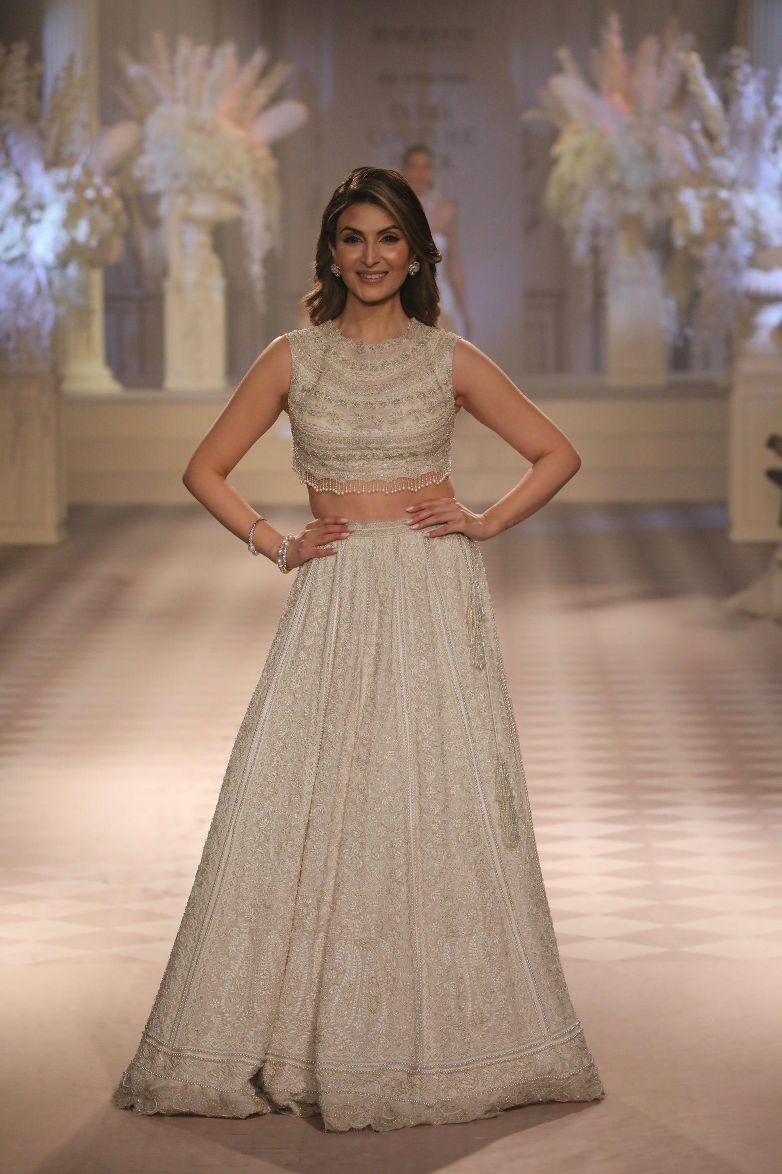 The couture weaves together the delicate threads of artisanal heritage and modern feminine strength.