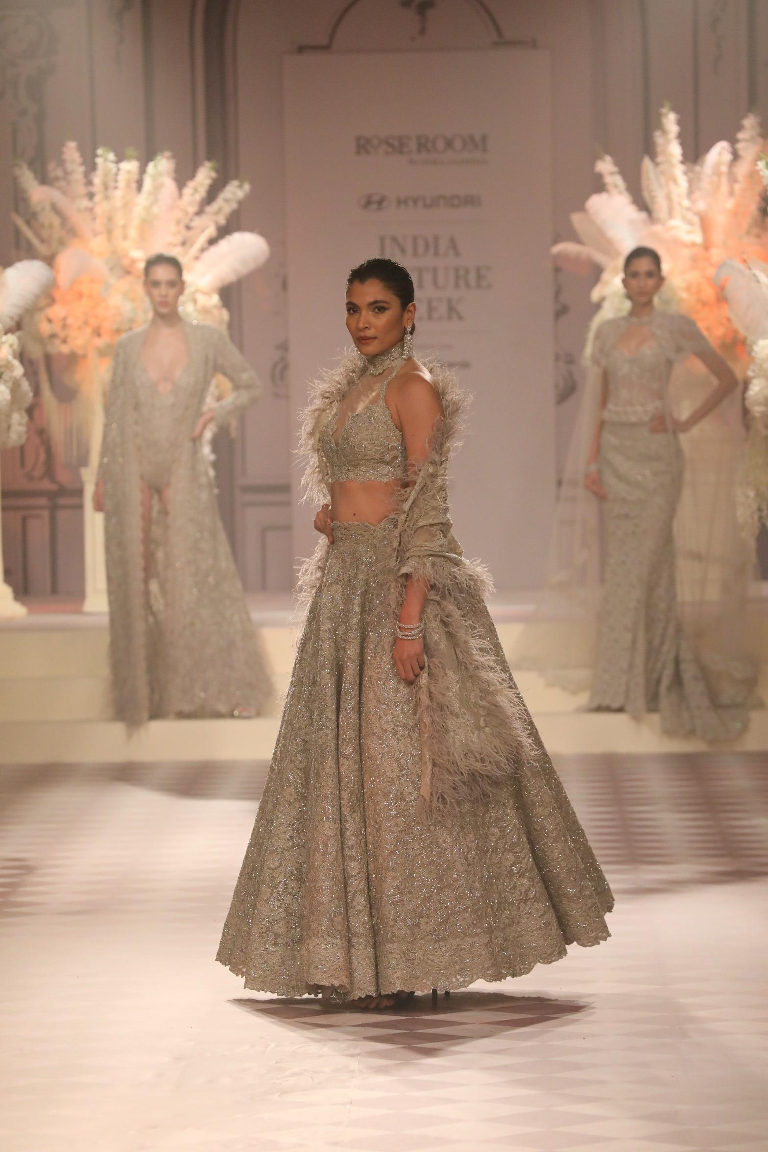 Delicate lace patterns reminiscent of stained-glass windows and luxurious fabrics exude a sense of palatial elegance.
