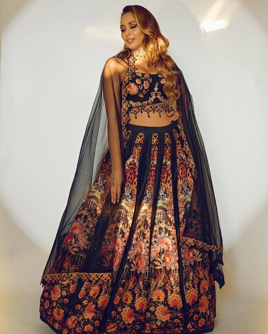 Iulia wore a Black Paradise Lehenga, which featured beautiful floral designs. The black lehenga had intricate embroidery all over the skirt.