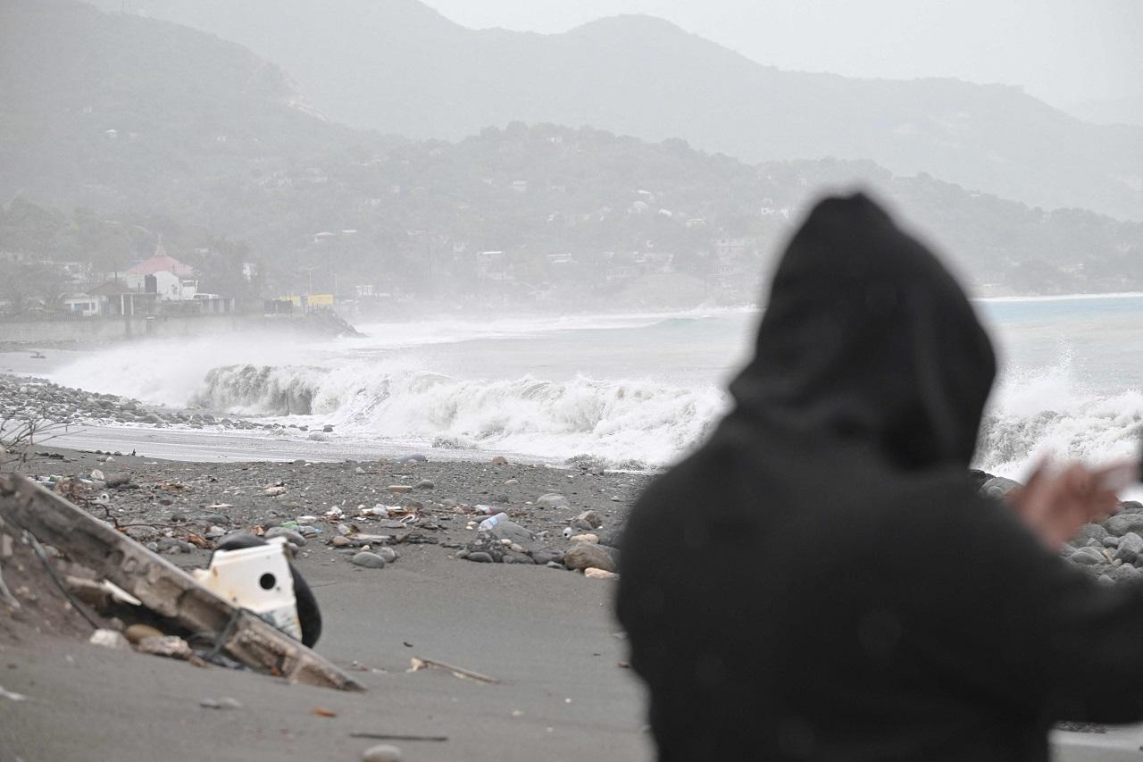 Wind-whipped rain pounded the island for hours as residents heeded authorities' call to shelter until the storm had passed. Power was knocked out in much of the capital