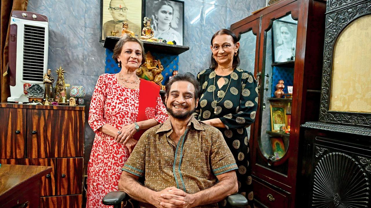 Sharmila Sunny, Mangala Nath and Ravi Pandit, backgrounded by their parents’ portraits, in their astrologer-politician father Vasant Kumar Pandit’s office room at Ramkrishna Niwas