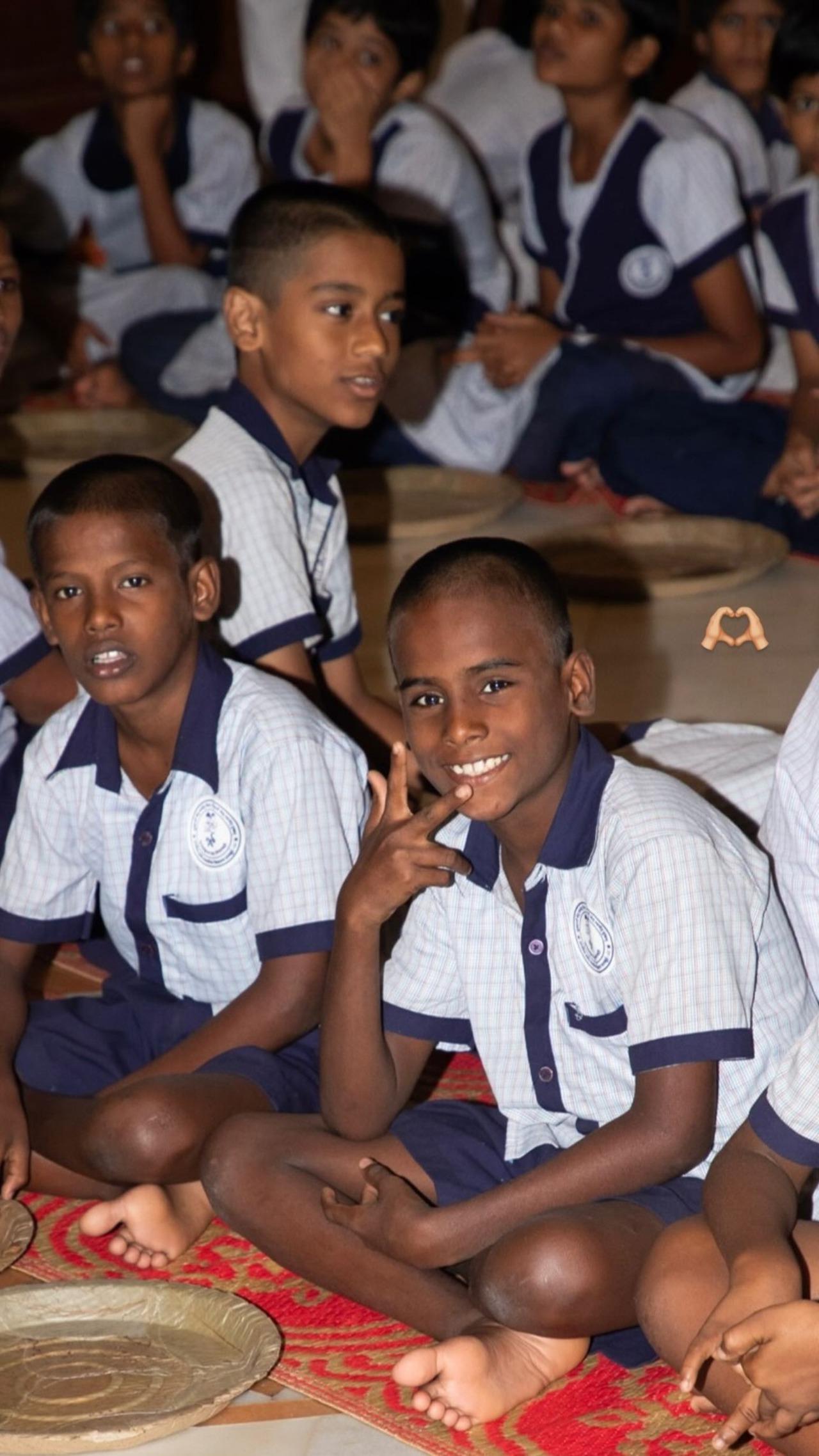 In this picture, we can see children posing for the camera and showing big smiles on their faces