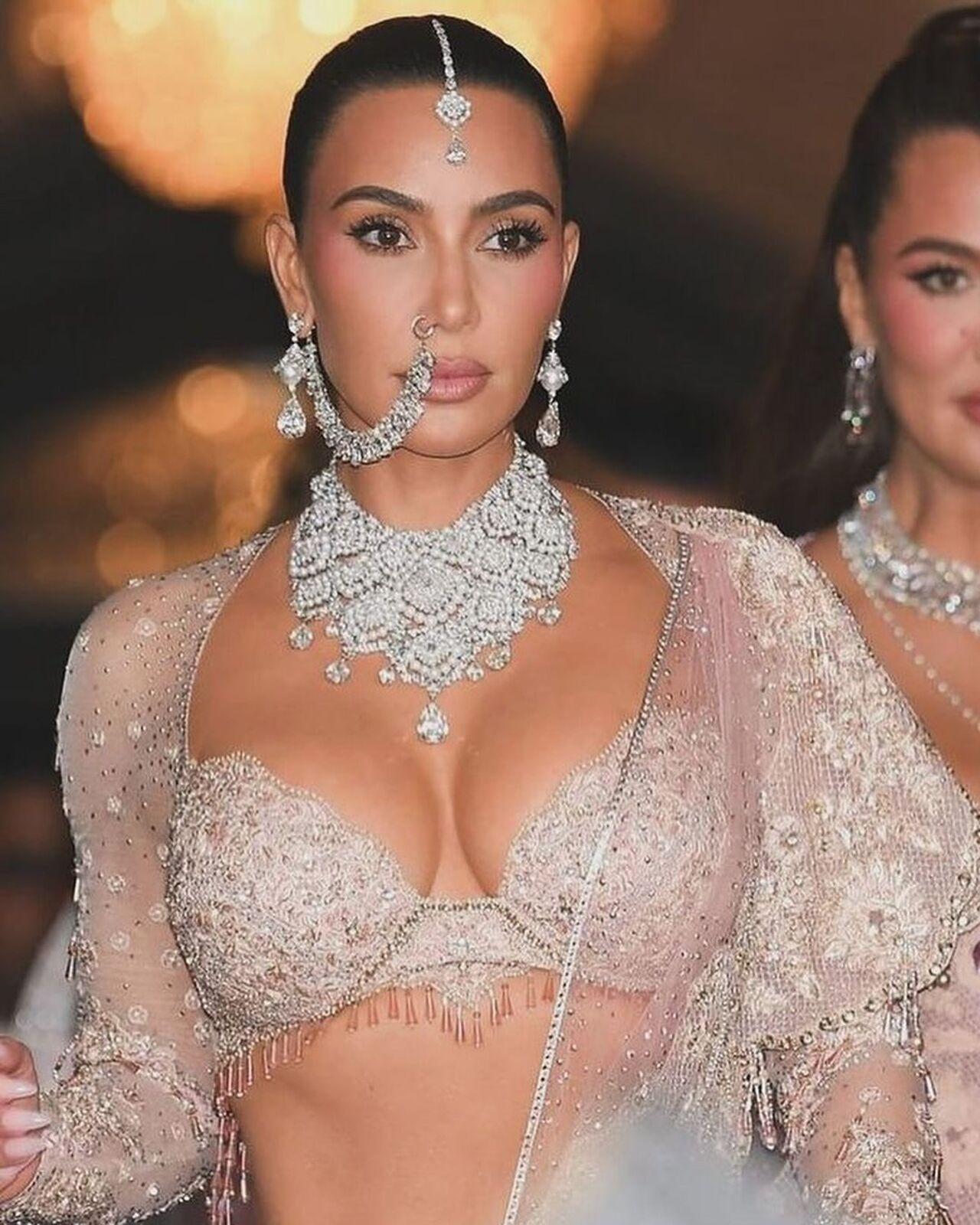 With her hair tied in a sleek ponytail, nude makeup, and a maang tika, Kim nailed the desi vibe check