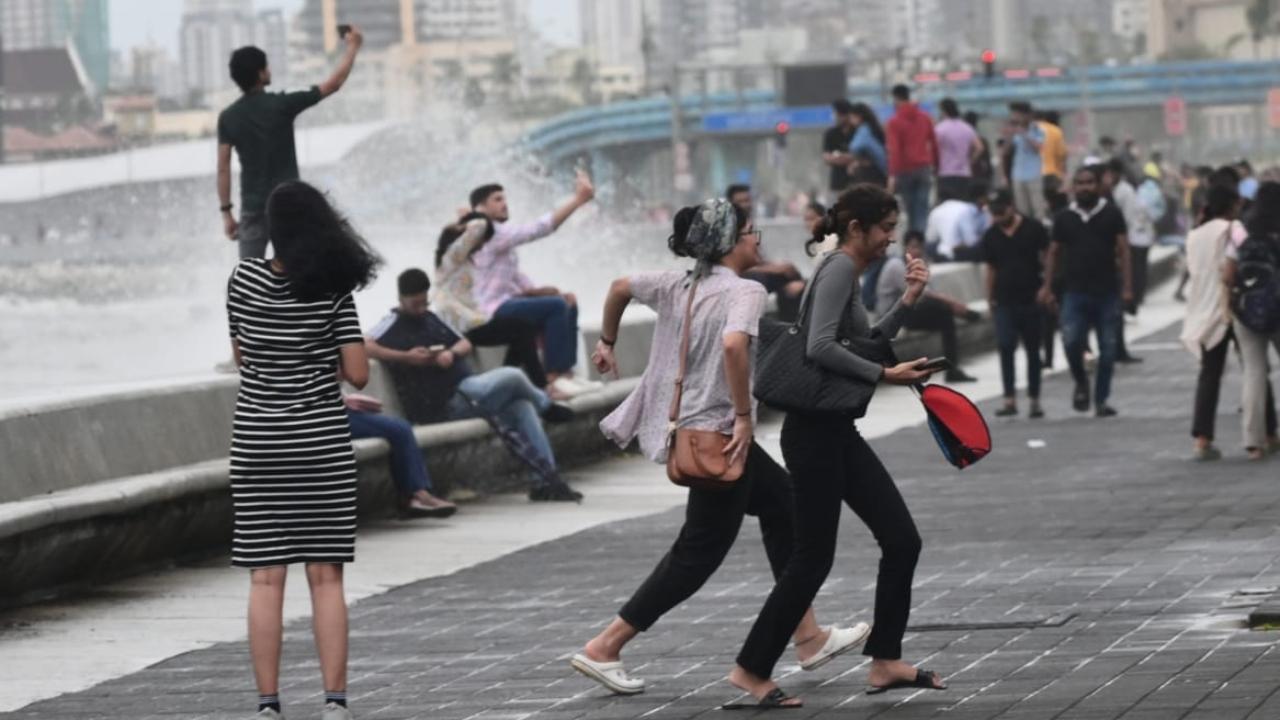 High tidal waves hit Marine Drive promenade on Saturday. Pics/Sameer Abedi