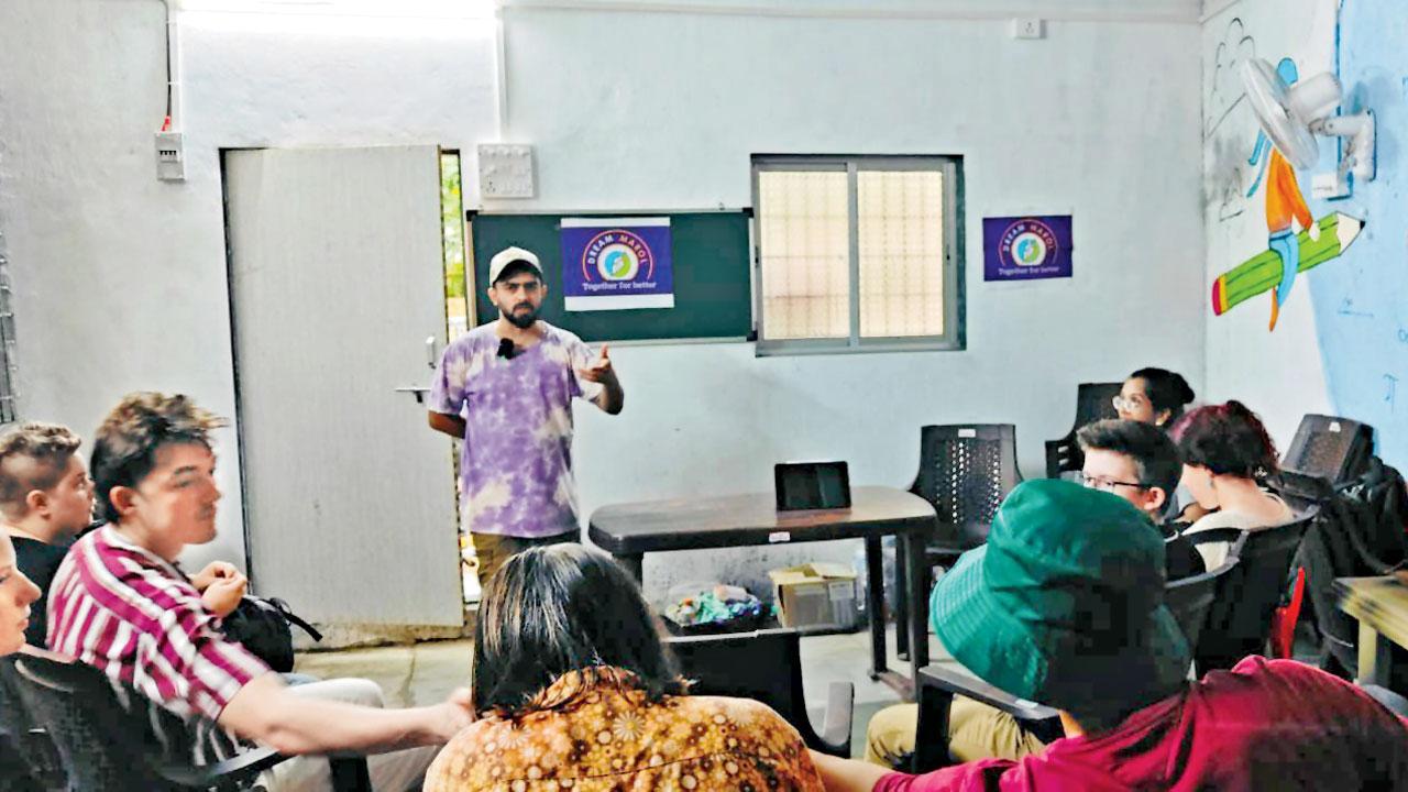 Omkar Dhareshwar (centre) interacts with the students in Marol