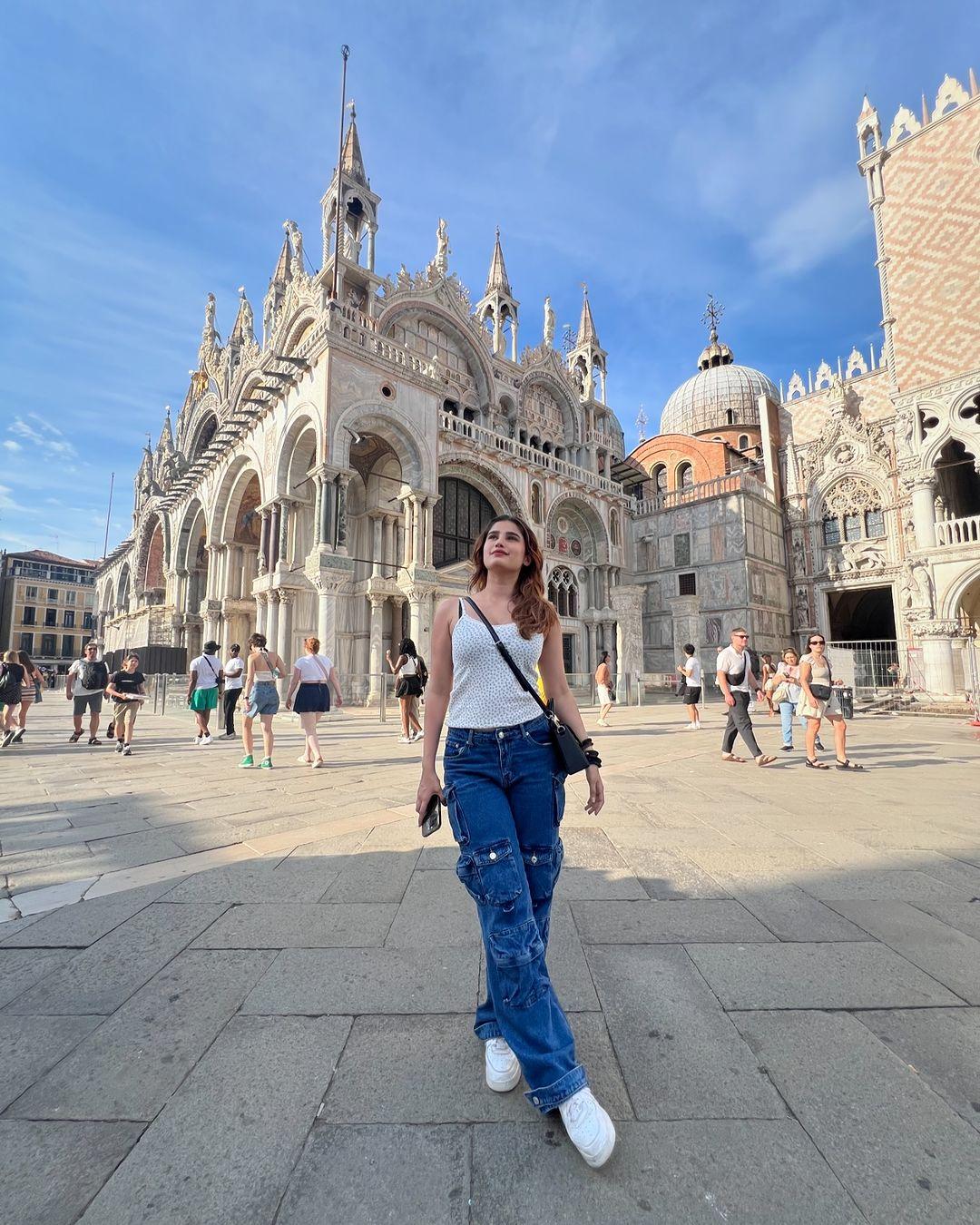 Like daughter, like mother: in this picture, Rasha posed in front of a picturesque background