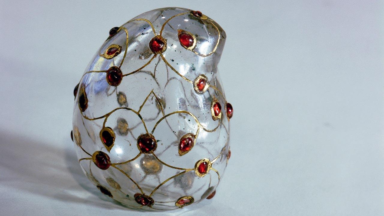 A rock crystal lime box in the shape of a mango, set with rubies inlaid in gold, dating back to the Mughal era of late 17th  century. Pic/Getty Images